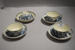 A group of four 18th century English porcelain teabowls and saucers, printed in under glaze blue