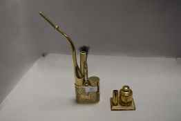 A brass Chinese style opium pipe decorated with horse design complete with accessories, and