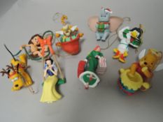 A collection of Disney Collectible ornaments, to include Christmas Magic and others, boxed.