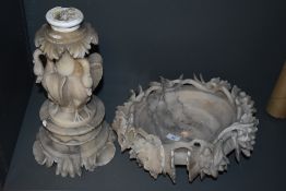 An Italian carved marble bird bath or font, the dished circular top with profuse fruiting vine