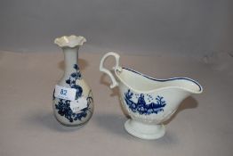 A 19th century English porcelain blue and white sauce boat, acanthus moulded and decorated with