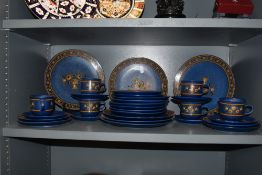 A mid century part dinner and tea service by Winterling Baveria in a blue floral design