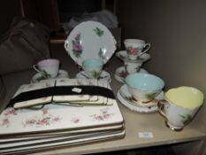 A part tea service by Roslyn china Wheatcroft Roses in a harlequin design with table matts