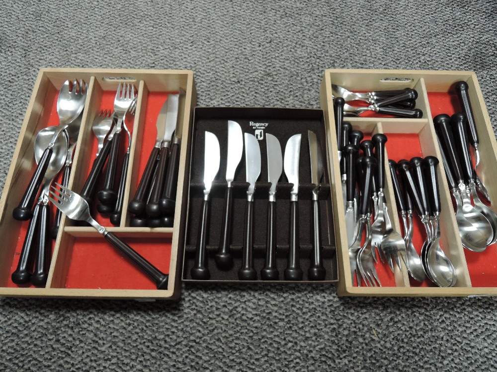 A selection of cutlery and flatware by Denby having ceramic handles in the Regency design