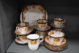 A quantity of Crown Bone China tea wares, with traditional foliate, cobalt and gilt decoration.