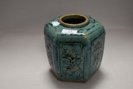 An antique Song Jun celadon glazed hexagonal ginger jar with embossed panels of plants and foliage