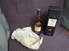 A bottle of Glenlivet 18 year old Single Malt Whisky, 43% proof, 70cl in blue leather case
