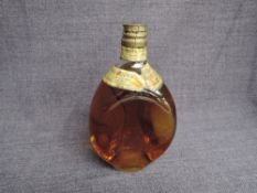 A bottle of John Haig Dimple Blended Scotch Whisky, no capacity stated, by appointment to the late