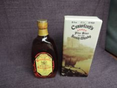 A 1970's bottle of Crawfords Five Star Blended Scotch Whisky, 70 proof, 26 2/3 fl oz, 75.7cl, in