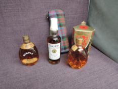 Three half or similar bottles of Blended Whisky, Teachers Highland Cream 70 proof in tartan bag,