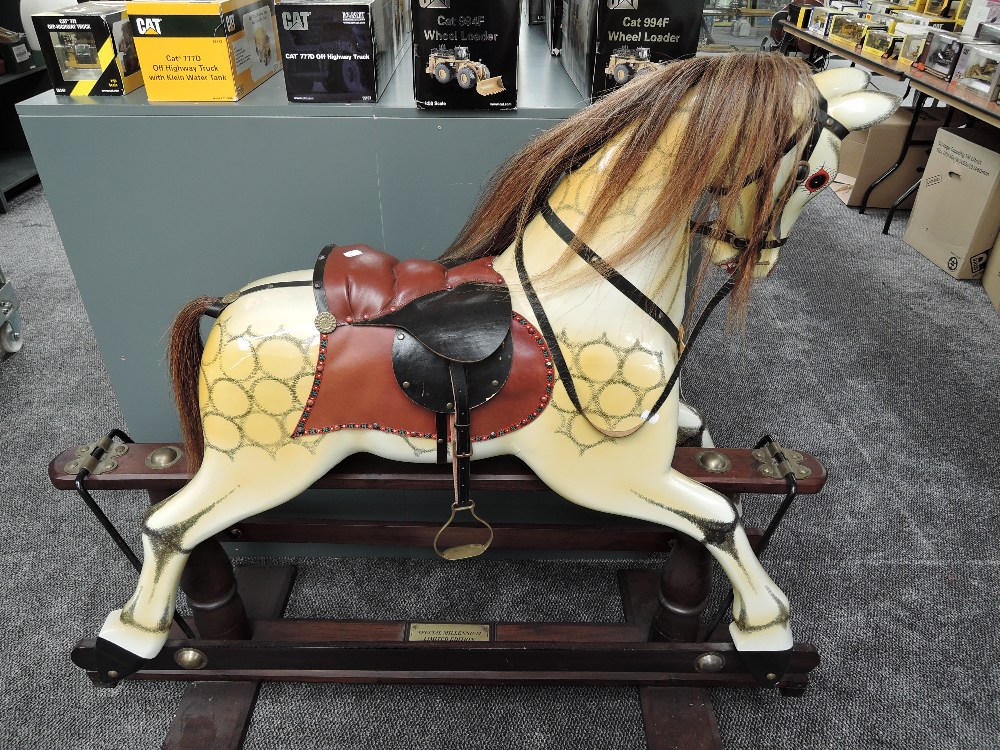 A modern traditional style Rocking Horse, dapple grey with horse hair mane and tail, leather