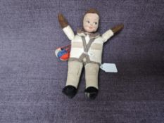 A 1940's Norah Wellings Cloth Doll, RAF Pilot wearing flying suit & parachute pack and having sown