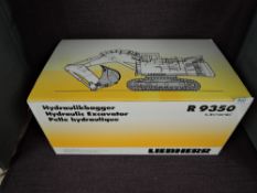 A NZG 1:50 scale diecasts, Liebherr R9350 Litronic Hydraulic Excavator in white, in polystyrene