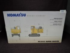 A NZG 1:50 scale diecasts, Komatsu PC3000 Super Shovel in yellow, in polystyrene packaging and in