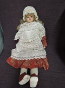 A vintage Doll having celluliod head with fixed open eyes and mouth, no marks seen, fully clothed,