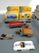 A small collection of six Dinky diecasts including Flat Bed and Trailer, Cunningham Sports Car,