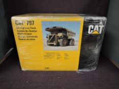 A NZG 1:50 scale diecast, Cat 797 Off-Highway Truck, in original polystyrene packaging and outer box