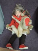 A vintage Doll having composition head with fixed open eyes and mouth, marked England with letters B