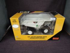 A Norscot Limited Edition 1:50 scale diecast, Cat 795F Off-Highway Truck Special White Edition