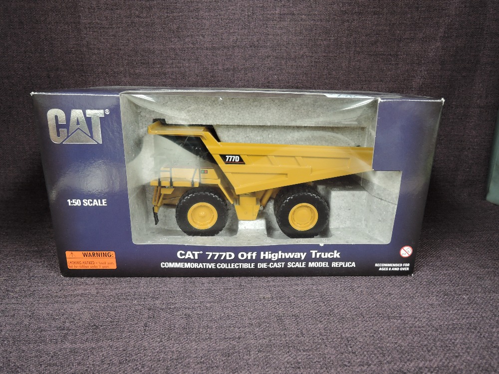 A Norscot 1:50 scale diecast, CAT 777D Off Highway Truck in yellow, commemorating 40,000 Off Highway