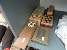 A set of modern treen Chess pieces in wooden box, two sets of Dominoes in wooden boxes, a mahogany