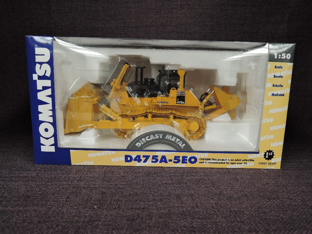 A First Gear 1:50 scale diecast, Komatsu D475A-5EO Crawler Dozer in yellow, in polystyrene packaging