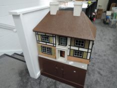 A 1930's possible Tri-ang Two Storey Dolls House, with letter stating retailed by Hamley's of
