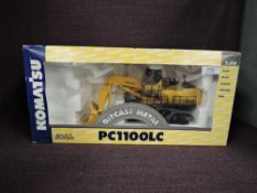 A Joal 1:50 scale diecast, Komatsu PC1100LC Hydraulic Front Shovel in yellow, in polystyrene