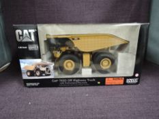 A Norscot 1:50 scale diecast, Cat 793D Off-Highway Truck, in original polystyrene packaging and