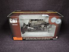 A Norscot limited edition celebrating 100 years on track 1:50 scale diecast, CAT D11R Track Type