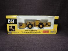 A Norscot 1:50 scale diecast, CAT R1700G LHD Underground Mining Loader in yellow, in polystyrene