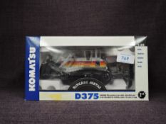 A First Gear 1:50 scale diecast, Komatsu D375 Bulldozer in white with multi coloured stripes Sunrise