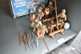 A collection of Ewok figures with boxed Glider and catapult