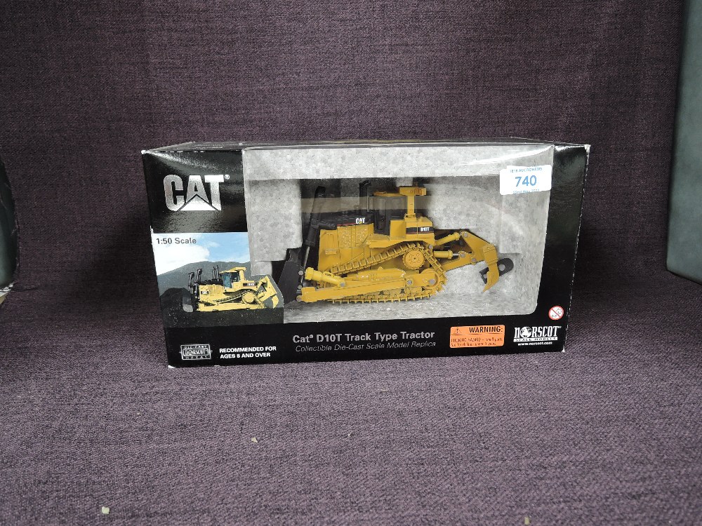 A Norscot 1:50 scale diecast, CAT D10T Track Type Tractor in yellow, in polystyrene packaging and in