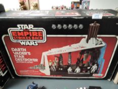 A boxed Star Wars Empire Strikes Back Darth Vaders Star Destroyer action playset