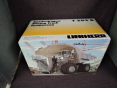 A Conrad 1:50 scale diecast, Liebherr Mining Truck T282B, in white, in original polystyrene