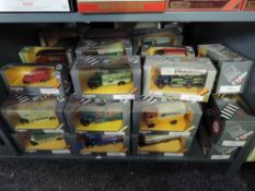A shelf of Corgi Classics advertising Vans, Buses and Cars all in window display boxes (44)