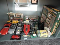 A box of mixed scale diecasts including 1:18 UT Model Porsche, Burago Ferrari, Bugatti Type 69, 1:14