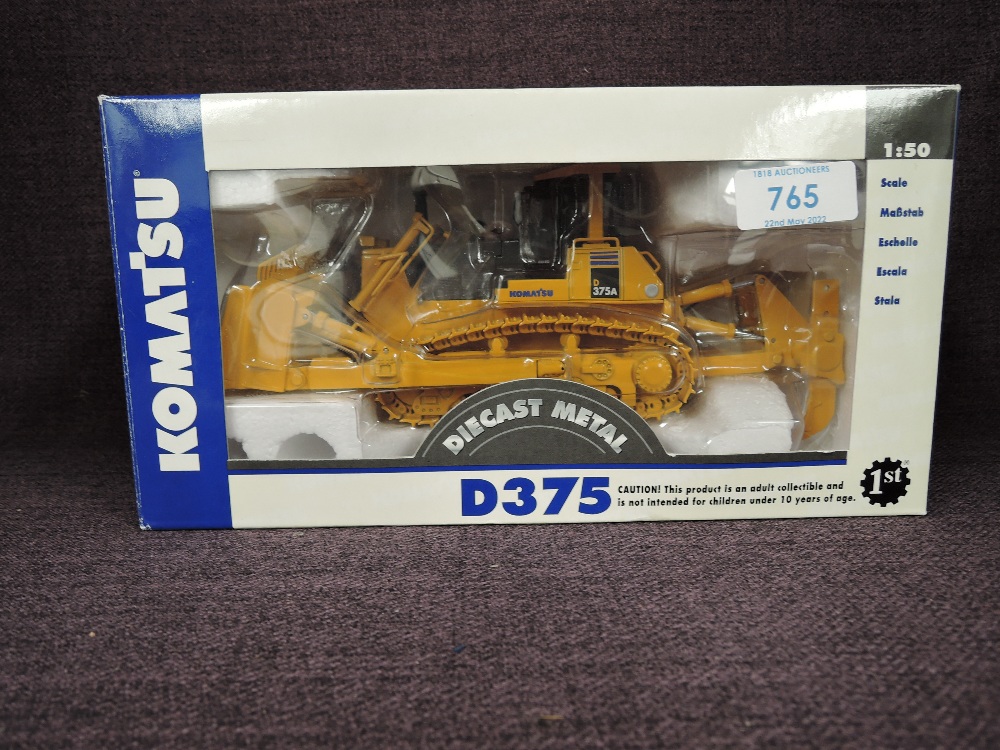A First Gear 1:50 scale diecast, Komatsu D375 Bulldozer in yellow, in polystyrene packaging and in