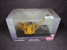 A Norscot 1:50 scale diecast, CAT 572E Track Type Pipelayer in yellow, in plastic packaging and in