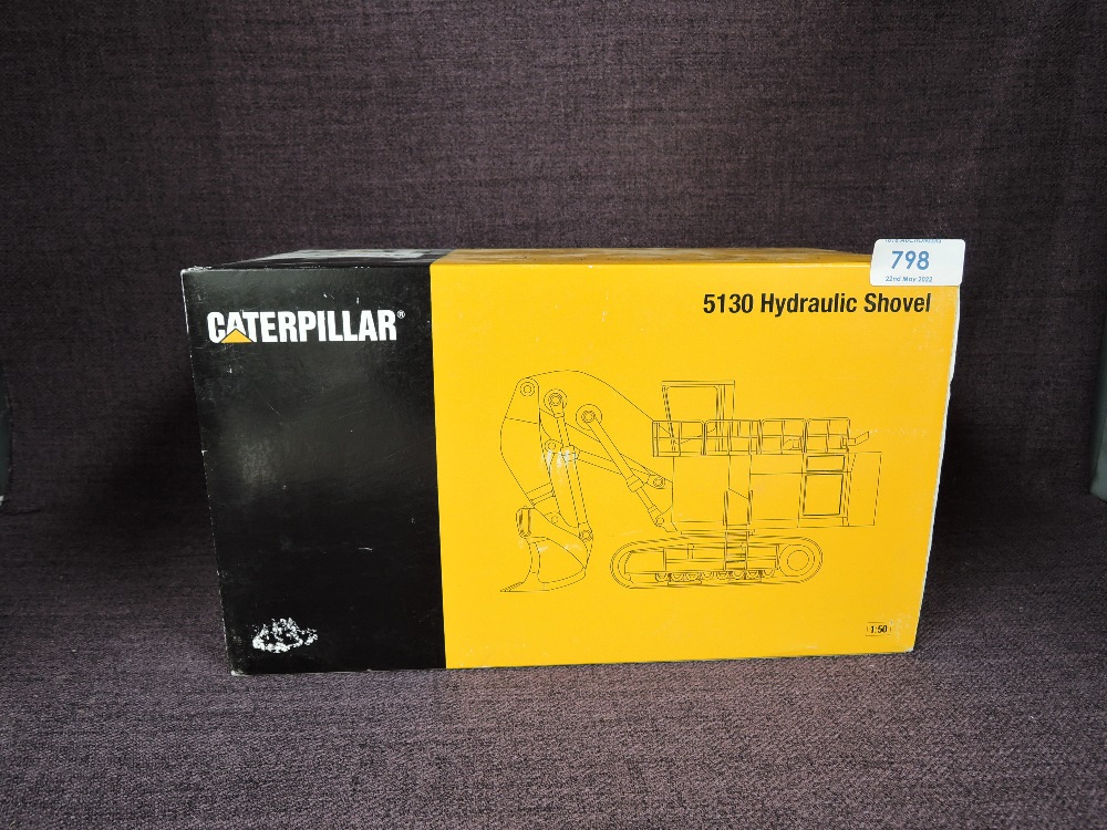 A NZG 1:50 scale diecasts, Caterpillar 5130B Hydraulic Shovel in white, in polystyrene packaging and