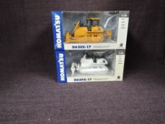 Two First Gear 1:50 scale diecasts, D65EX-17 Crawler Dozer in yellow and D65PX-17 Crawler Dozer in