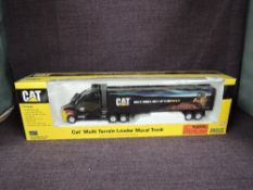 A Norscot 1:50 scale diecast, CAT Multi Terrain Loader Mural Truck, in original polystyrene