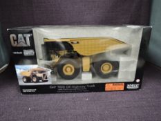 A Norscot 1:50 scale diecast, Cat 793D Off-Highway Truck, in original polystyrene packaging and