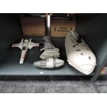 Three unboxed Star Wars vehicles including transport ship, B wing and X Wing