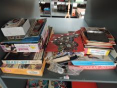 A shelf of vintage Games, Football Memorabilia and Coin Collections including Airfix Gun Emplacement