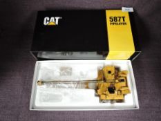 A CCM Classic Construction Models 1:48 scale diecast, CAT 587T Pipelayer Excavator in yellow, in