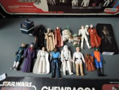 A collection of early rare Star Wars figures including Yoda, Storm trooper luke and Han Solo