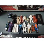 A collection of early rare Star Wars figures including Yoda, Storm trooper luke and Han Solo