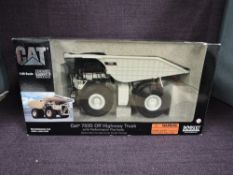 A Norscot 1:50 scale diecast, CAT 793D Off Highway Truck, in white, in original polystyrene